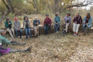 Participants sitting along a long on the field trip to St. David Cienega, Arizona.
